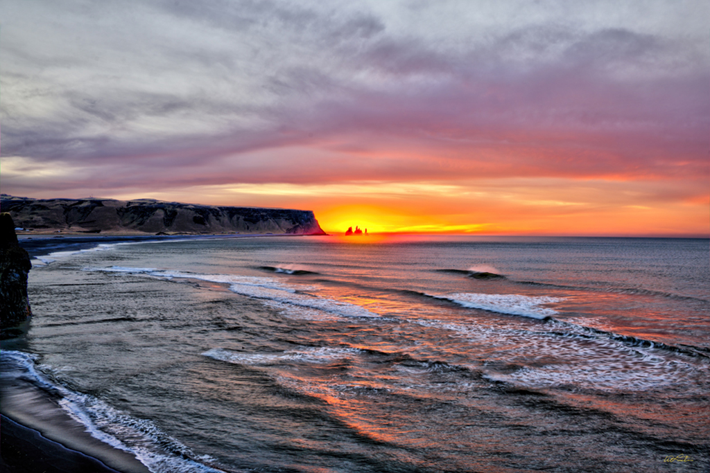 Photo of shoreline at sunset